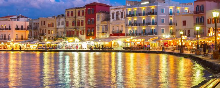 Chania Harbour at dusk with the pretty lights on the water, such a romantic atmosphere