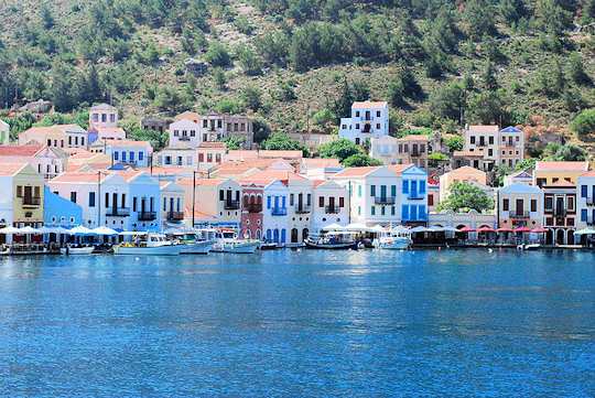 Kastellorizo Village homes are colourful and reflect on the clear waters of the harbour - life is full of time and show, restful days (image by Merle ja Joonas)