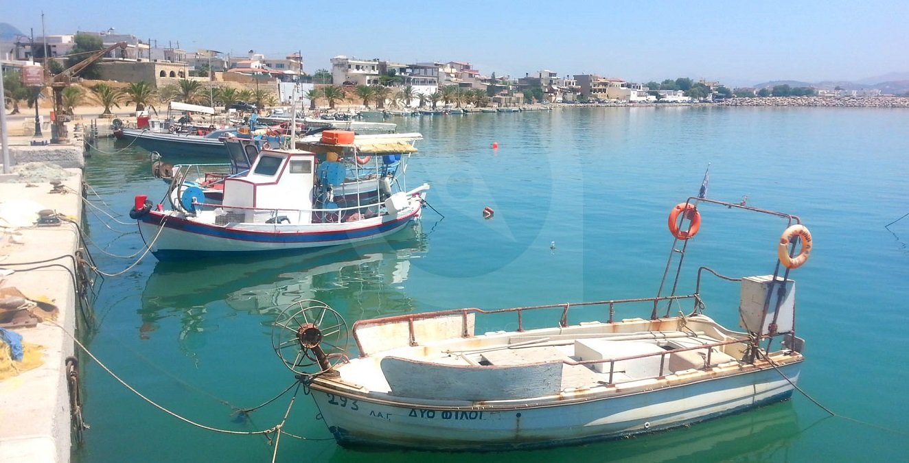 Modern Greek fishing boat moored in the harbour of the beautiful